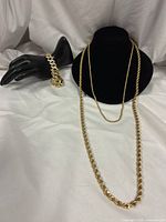 Full lot view: two rope chains and CZ bracelet displayed