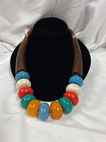 Front view showing arrangement of large multicolor beads and horn segments