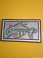 Front view showing entire framed etched aluminum orca plaque