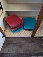 All three glass baking dishes with lids in cabinet