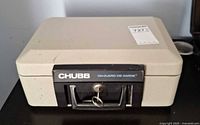 Front view of CHUBB fireproof safe showing brand panel, key lock, handle