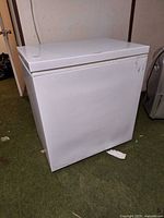 Front left view of white chest freezer