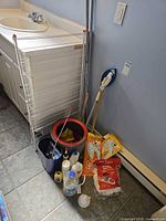 overview of drying rack, spin bucket, cleaning bottles, refill packs