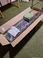 Open box showing sealed grow tent fabric, assembly instructions and boxed Likesuns LED light