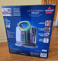 Front of boxed Bissell Little Green ProHeat cleaner