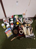 Overall view of assorted painting tools, tapes, rollers and cleaners