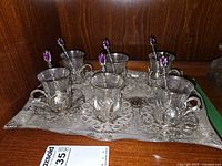 Full set on tray showing six cups with holders, six spoons, overall look and condition