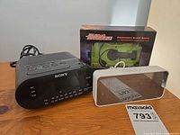 All three items: Sony clock radio, boxed emergency alert radio, TODO LED clock