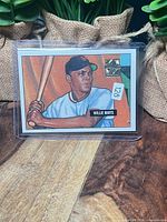 Front of Willie Mays commemorative card in protective sleeve