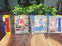 Three sealed 1989 Fleer Baseball wax packs on table
