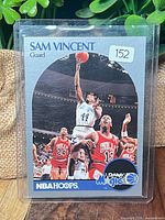 Front of card inside toploader showing Sam Vincent with Michael Jordan #12 jersey