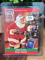 Front of 1990 Pro Set Santa Claus Head Coach card in protector