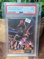 Front of PSA-slabbed Shaquille O'Neal Stadium Club #201 card showing grade label Mint 9