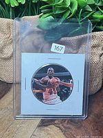 Front view of round Upper Deck basketball insert card in 2x2 flip