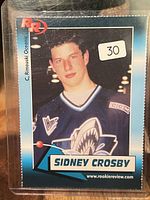 Front view of Sidney Crosby Rookie Review trading card in protective sleeve