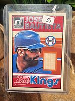 Front view of card in protective holder showing overall design and condition