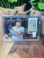 Front of the card in plastic holder showing Aaron Judge artwork and Prizm Star Gazing branding