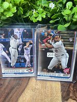Fronts of both Vladimir Guerrero Jr. rookie cards in top loaders