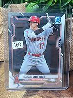 Card front in top loader showing overall condition and inventory sticker 160