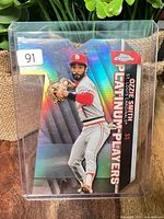 Front view of Ozzie Smith die-cut card in top loader