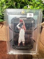 Front view of Victor Wembanyama rookie card inside clear magnetic holder