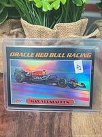 Front of holographic Topps F1 Max Verstappen card in top-loader