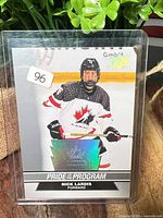 Front of Nick Lardis Pride of the Program card in sleeve/toploader