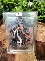 Front of Victor Wembanyama Panini Mosaic rookie card in magnetic holder