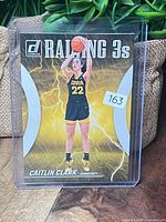 Front of Caitlin Clark Raining 3s insert card in sleeve