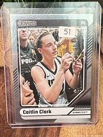 Front of card in toploader showing Caitlin Clark image and card branding