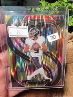 Front of holographic Panini Select rookie card in plastic sleeve