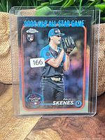 Front view of sleeved 2024 Topps Chrome Paul Skenes refractor card