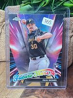 Front of card in holder showing refractor design and player image