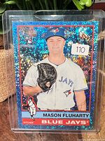 Front of Mason Fluharty blue sparkle refractor rookie card in holder