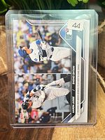 Front of 2024 Topps NOW card in top loader showing Judge and Ohtani images