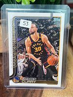 Front of sleeved 2025 Topps Stephen Curry #135 card