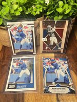 Group shot of all four Bo Bichette rookie cards in top loaders