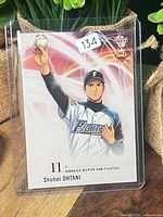 Card in top loader showing pitching illustration, full view