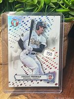 Front view of Freddie Freeman Topps Pristine Refractor card in sleeve
