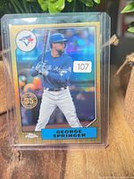 Front of George Springer 2022 Topps Chrome refractor card in top loader