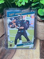 Front of Jalen Hurts Panini Prestige #193 card in top loader