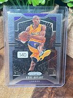 Front of Kobe Bryant Panini Prizm card in sleeve showing card number and design