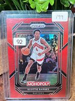 Front of Panini Prizm Monopoly Scottie Barnes Red parallel trading card in top-loader