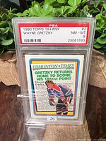 Front of PSA slab showing label and card