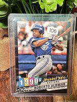 Front of Roberto Alomar Topps 1990s Decades' Best black border card in sleeve
