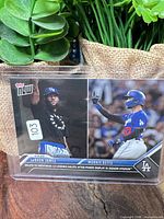 Front of card in sleeve showing LeBron James and Mookie Betts images
