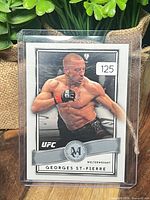 Front view of Georges St-Pierre Museum Collection card inside protective sleeve