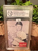 Front view of encapsulated Mickey Mantle Rawlings custom art card