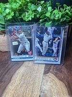 Two Vladimir Guerrero Jr. Topps Update rookie cards in top loaders on tabletop