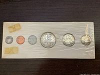 Sealed proof-like set obverse sides visible in cardboard holder